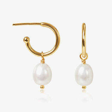 Gold hoop earrings with pearl drops on a white background